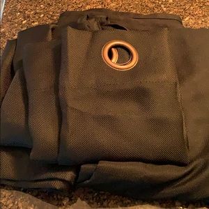 Two 84” black grommet-style curtains